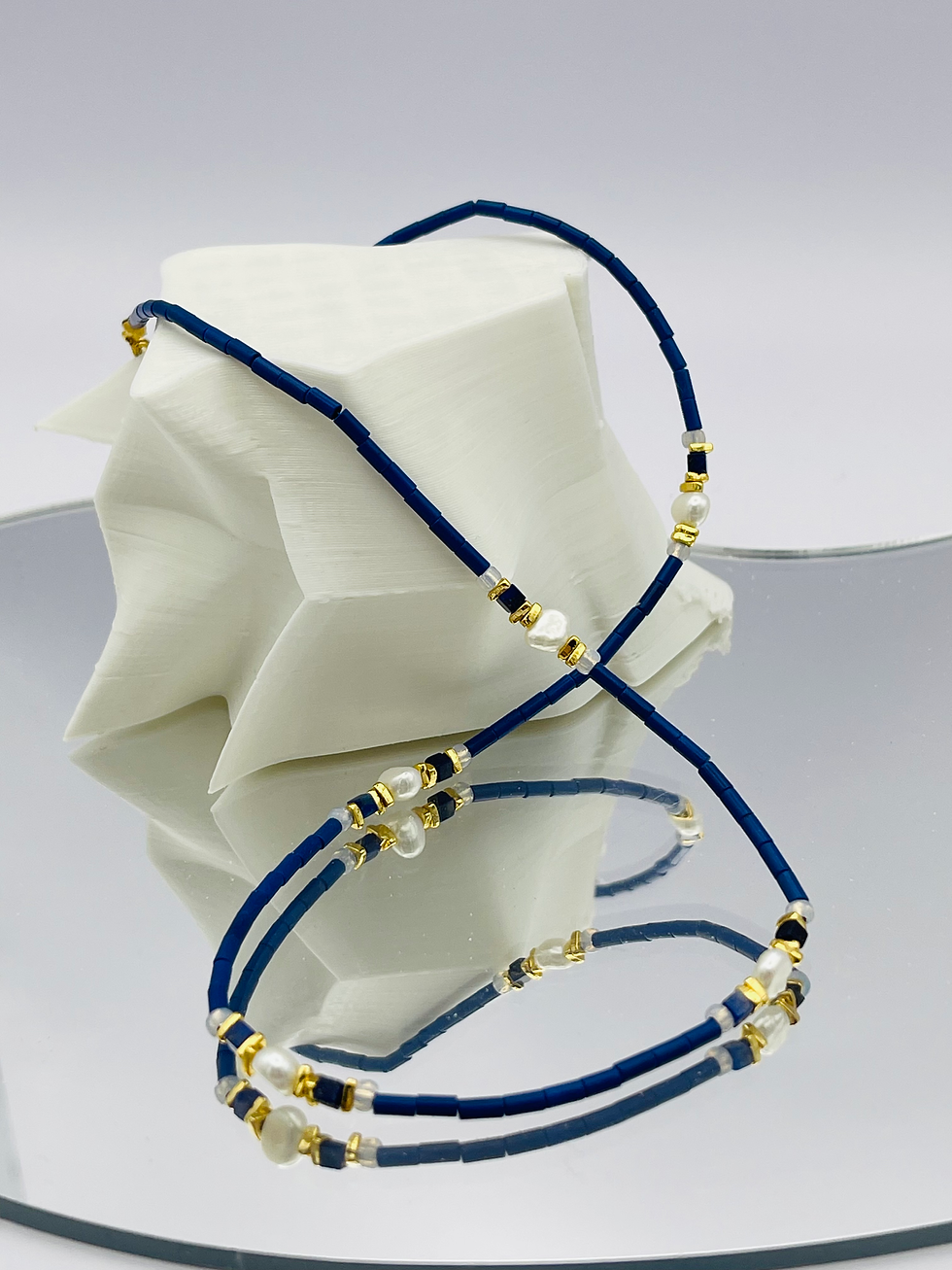 Thumbnail: Blue stone with pearl side view