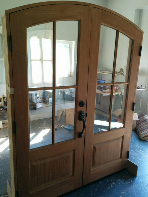 arched wooden entry door