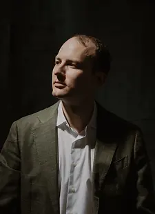 Portrait photo of Toby Carr looking to the side