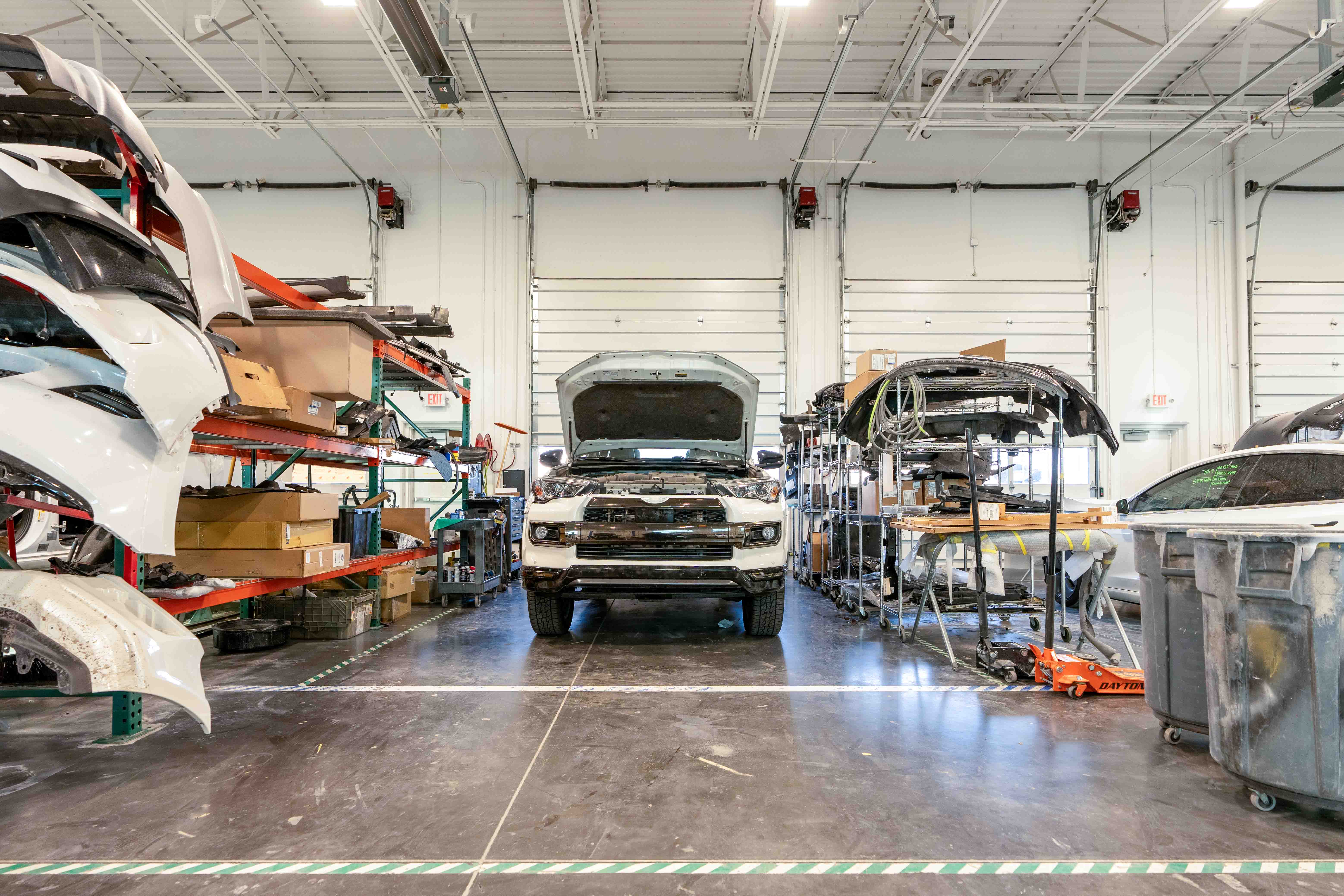 Modern auto repair garage bays full of cars, demonstrating the results of successful auto repair SEO strategies