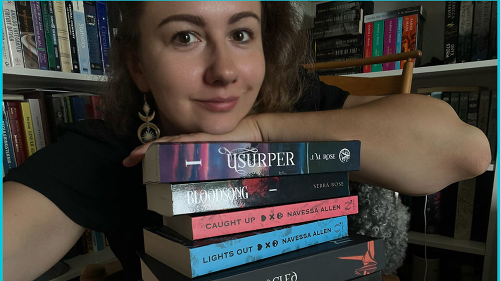 Emile the author of Moonlit awakening holding