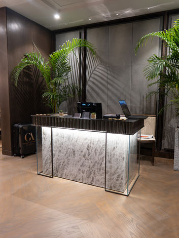 The luxurious reception area of the GA Salons in Jeddah, Saudi Arabia, featuring opulent modern decor, comfortable seating, and an atmosphere of exclusive privacy.