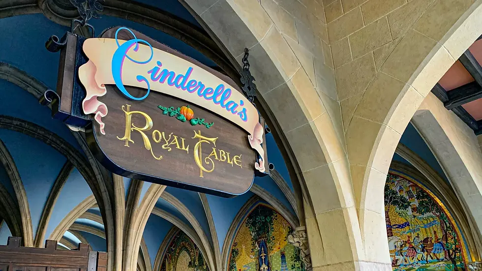 Entrance sign for Cinderella’s Royal Table restaurant inside Cinderella Castle at Magic Kingdom, one of the most popular Disney dining reservations.