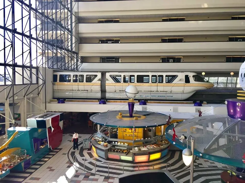 Disney's Contemporary Resort with the Walt Disney World monorail passing through the center of the iconic resort lobby.