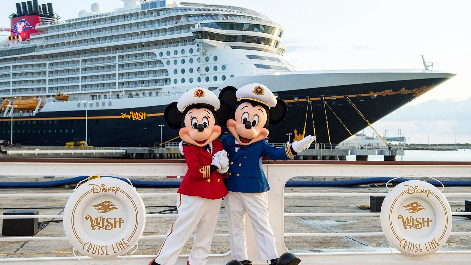 Mickey and Minnie aboard a Disney Cruise Line ship, featured in a family travel comparison by Dani Garcia of Paradise and Pixie Dust Travel Agency.