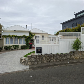 Final completed stamped concrete driveway transformation in Napier, NZ, showcasing widened access, r