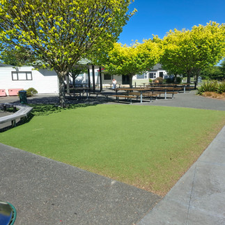 Public outdoor space before artificial lawn installation in Hastings