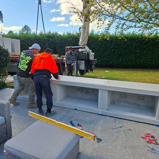 HIAB crane lifting precast base components for Flare outdoor fireplaces installation in Hastings