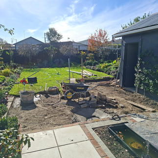 Excavation underway for a new concrete patio area as part of a backyard landscaping project in Napie