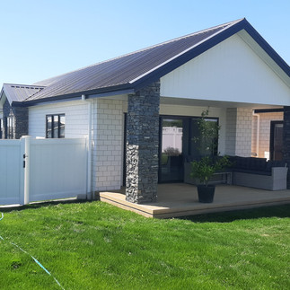 PVC fencing installed around new build home with covered patio area in Hastings