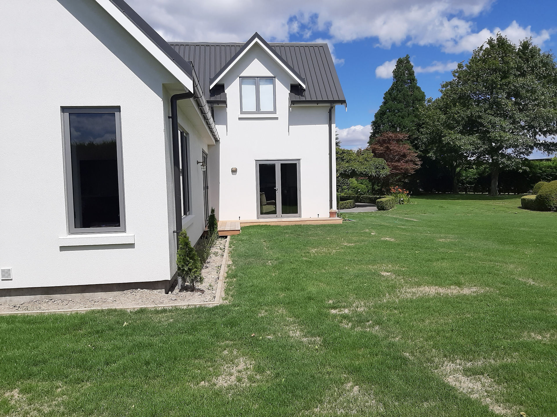 New lawn established around completed home as part of landscaping in Hastings