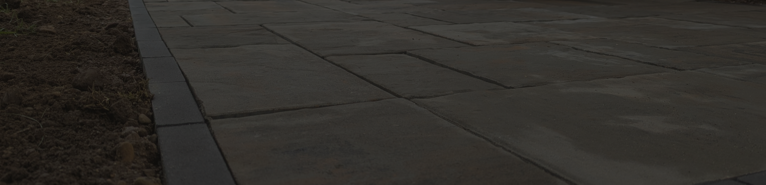 Unilock Beacon Hill Alpine Grey paver patio with solder border