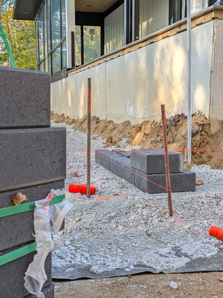 Unilock Quarry Smooth Midnight Charcoal installation with string lines