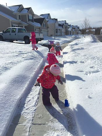 A snowy neighborhood walk for the Blue Sky Daycare children