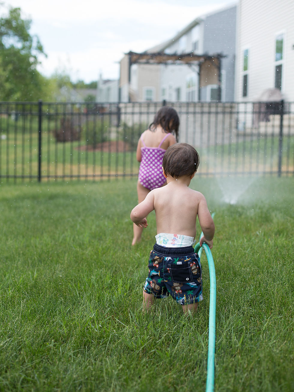 Children enjoy playing in the water at Blue Sky Daycare