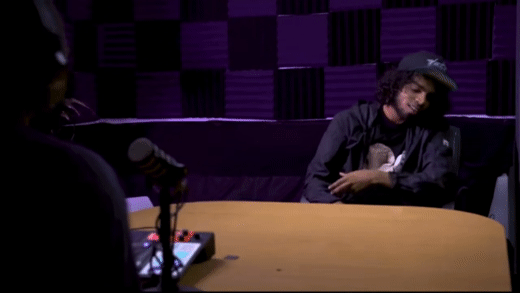 Mowgz sitting down with Bobby Kasanga for an interview on the Big Ego Podcast, Big Ego Media