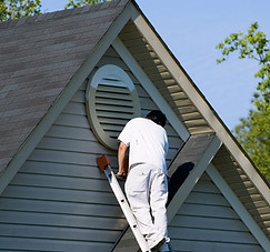 Man painting house D.A.M Constructions LLC