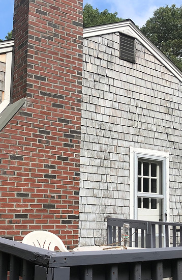 Old shingles on a house D.A.M Constructions LLC