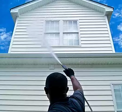 Black man washing house D.A.M Constructions LLC