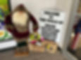Entry to Creative Reuse Center with santa statue and welcome sign