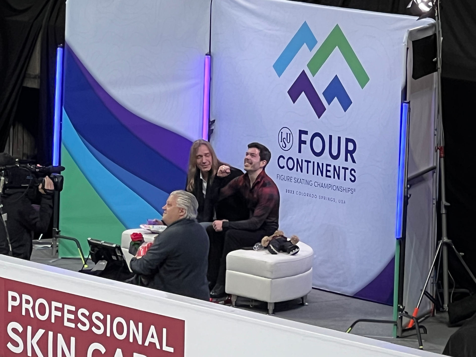 Keegan Messing with this coach in the kiss-and-cry area following his free skate at the 2023 ISU Four Continents Figure Skating Championships