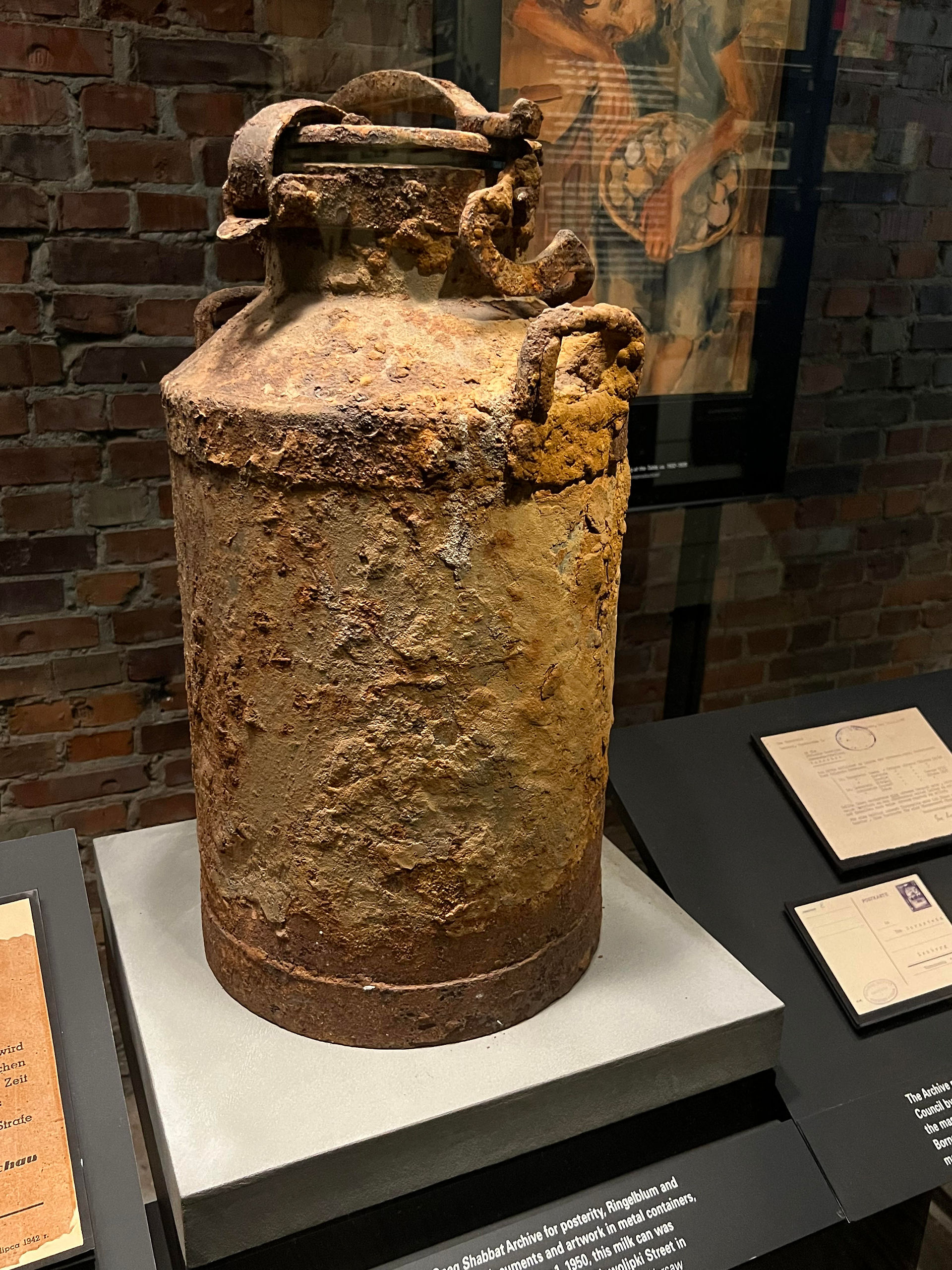 Metal milk can that had contained documents and artwork and was buried inside the Warsaw ghetto