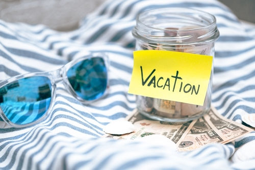 A themed vacation tip jar, symbolizing saving money for a dream vacation