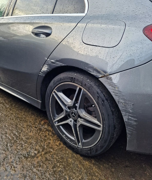 Mercedes with rear quarter damage