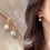 थंबनेल: unique spiral Pearl Drop Minimalistic Earrings