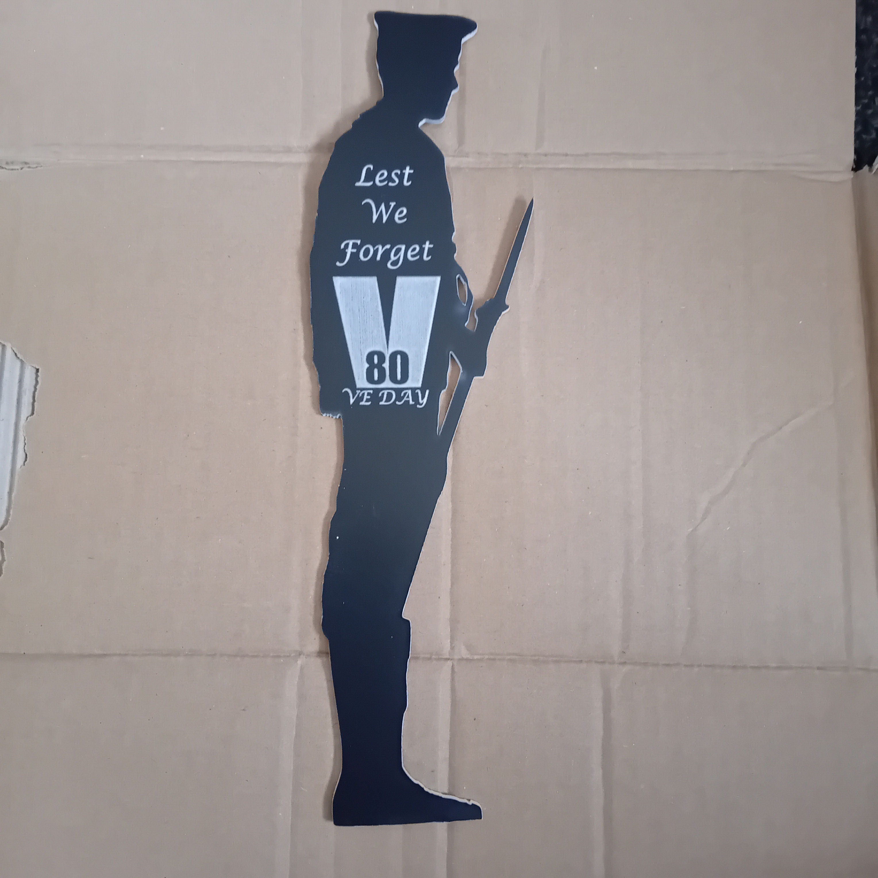 A Black Acrylic Standing British Sailor Lest We Forget 80th VE Figure