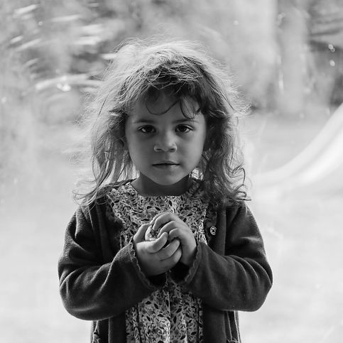 black and white photogaphy little girl throwing ball