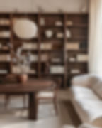 Scandinavian living room with dark walnut furniture and muted color palette, 2026 trend.