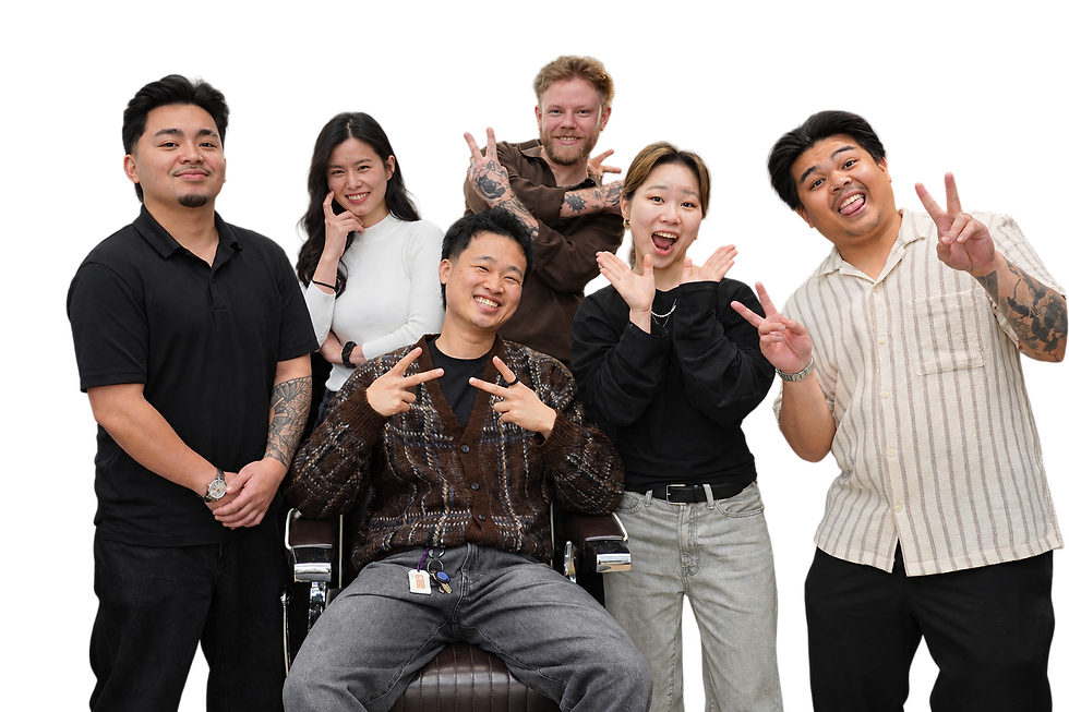 The Ikigai Barbers team gathered around a barber chair