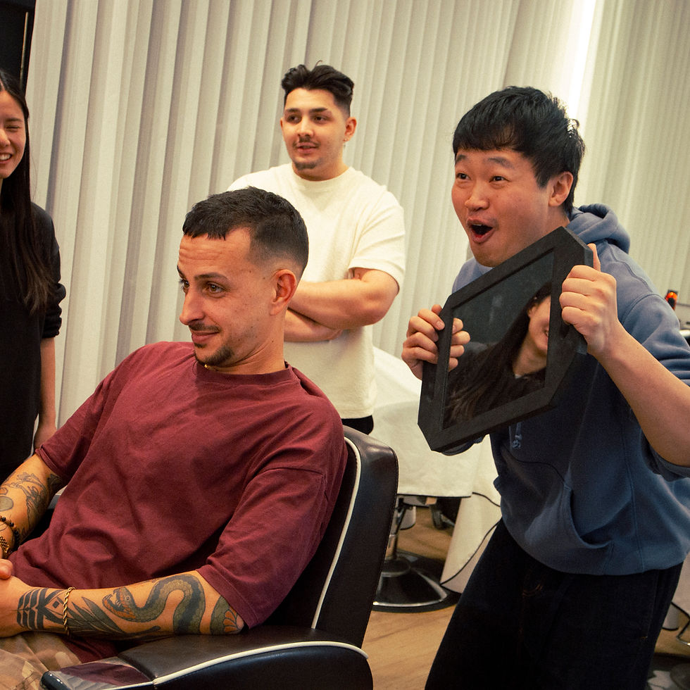 A client receiving a haircut from an Ikigai barber