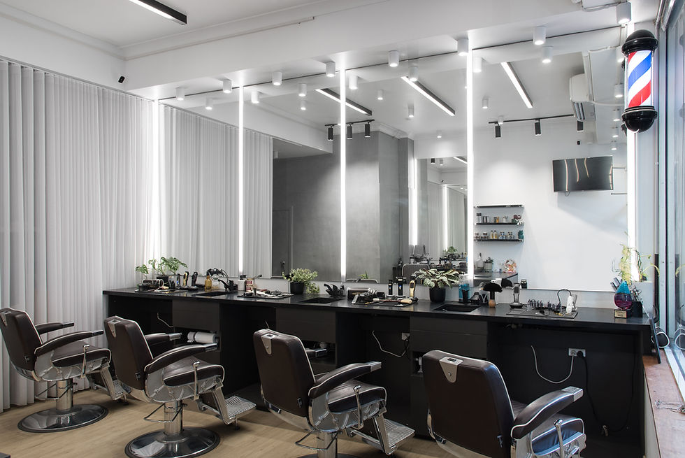 Barber chairs and mirrors in the Ikigai Barbers shop interior