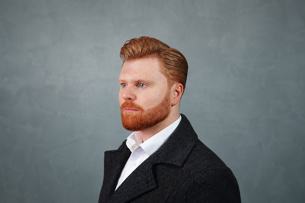 Slicked-back haircut and groomed beard styled by Ikigai Barbers