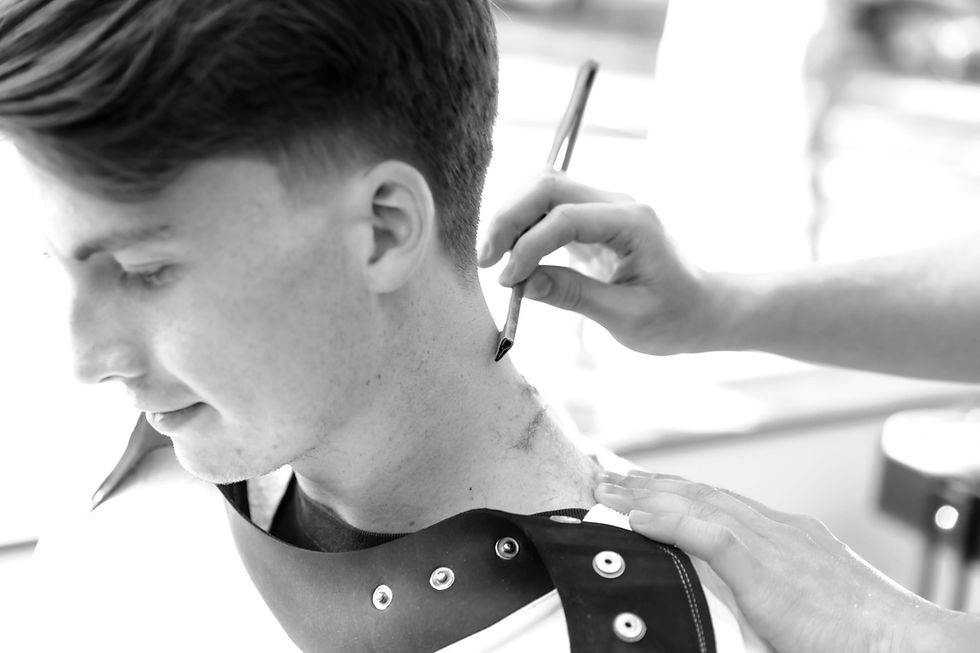 Close-up of a barber refining a short haircut at Ikigai Barbers