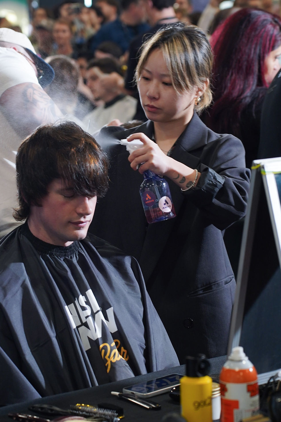 Barber styling a client's hair at Hair Festival