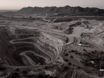 Panoramic view of Arizona’s Copper Triangle mines, showcasing an open pit.