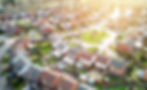Ariel view of a housing estate with house needing a survey.