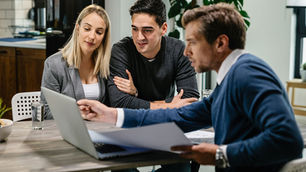 Young couple and solicitor preparing to challenge a will