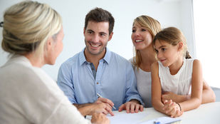 Young family signing a Scottish Continuing Power of Attorney
