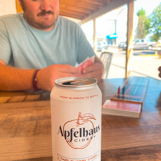 cider with man playing cards