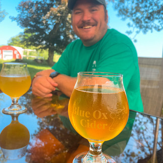 man with cider at winery