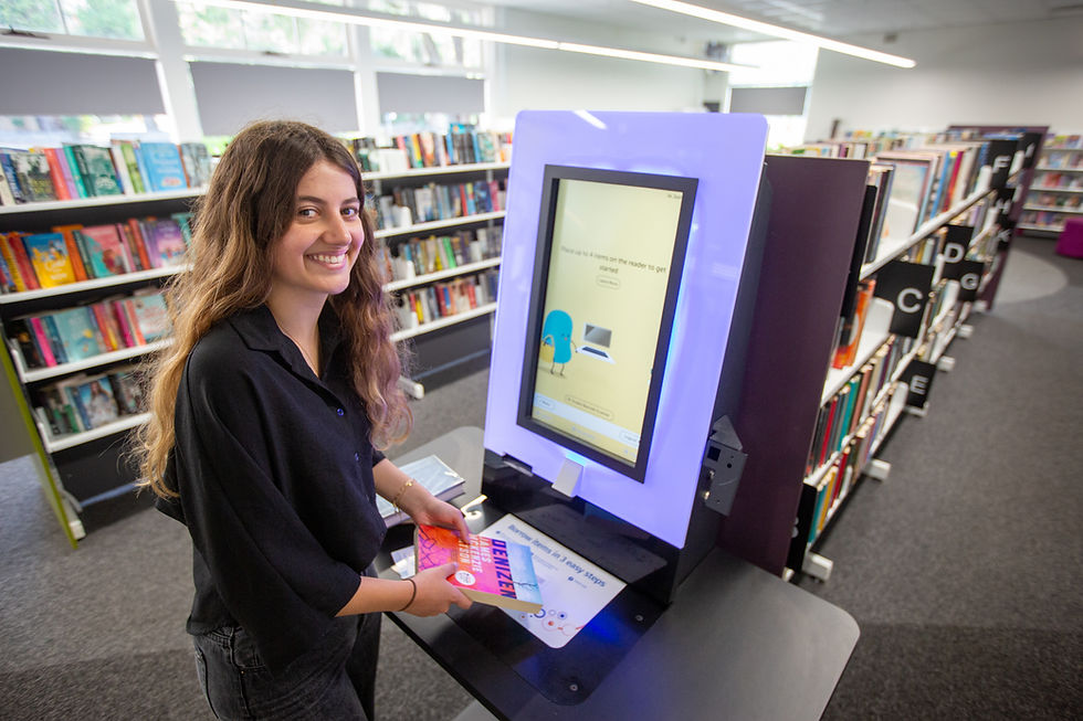 girl borrowing books from the library