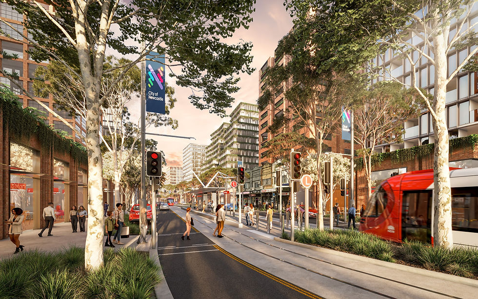 Urban street scene with people walking near a red tram. Tall buildings and trees line the street. "City of Newcastle" banner visible.