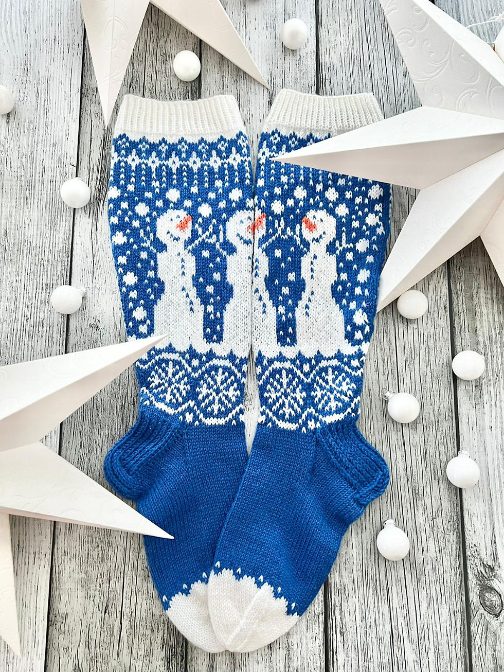 Hand-knitted Snowman Socks with white and blue colorwork and cute snowmen design.