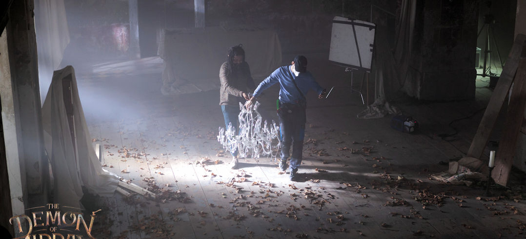 Cinematographer Faraz and gaffer Murat making some prop adjustments