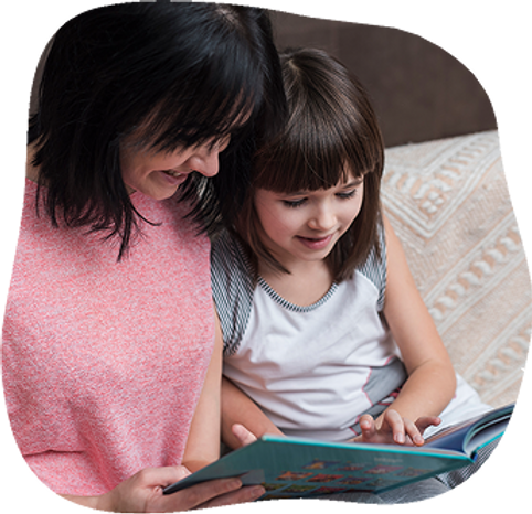 mother-daughter-reading-book-couch 1.png