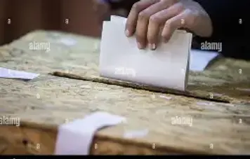 Voters at polling station.webp